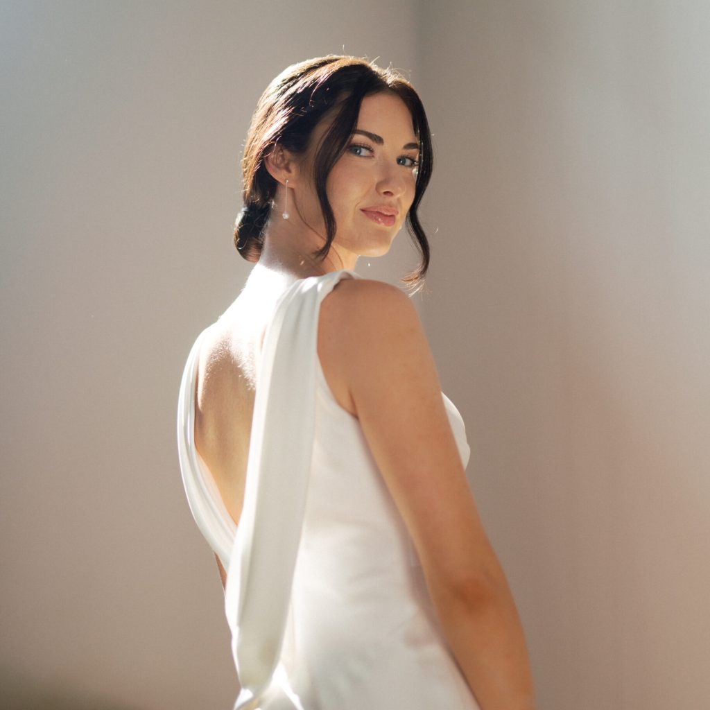 Wedding Hair and Makeup Company – Perfecting Bridal Beauty. A bride getting wedding day hair and makeup done.